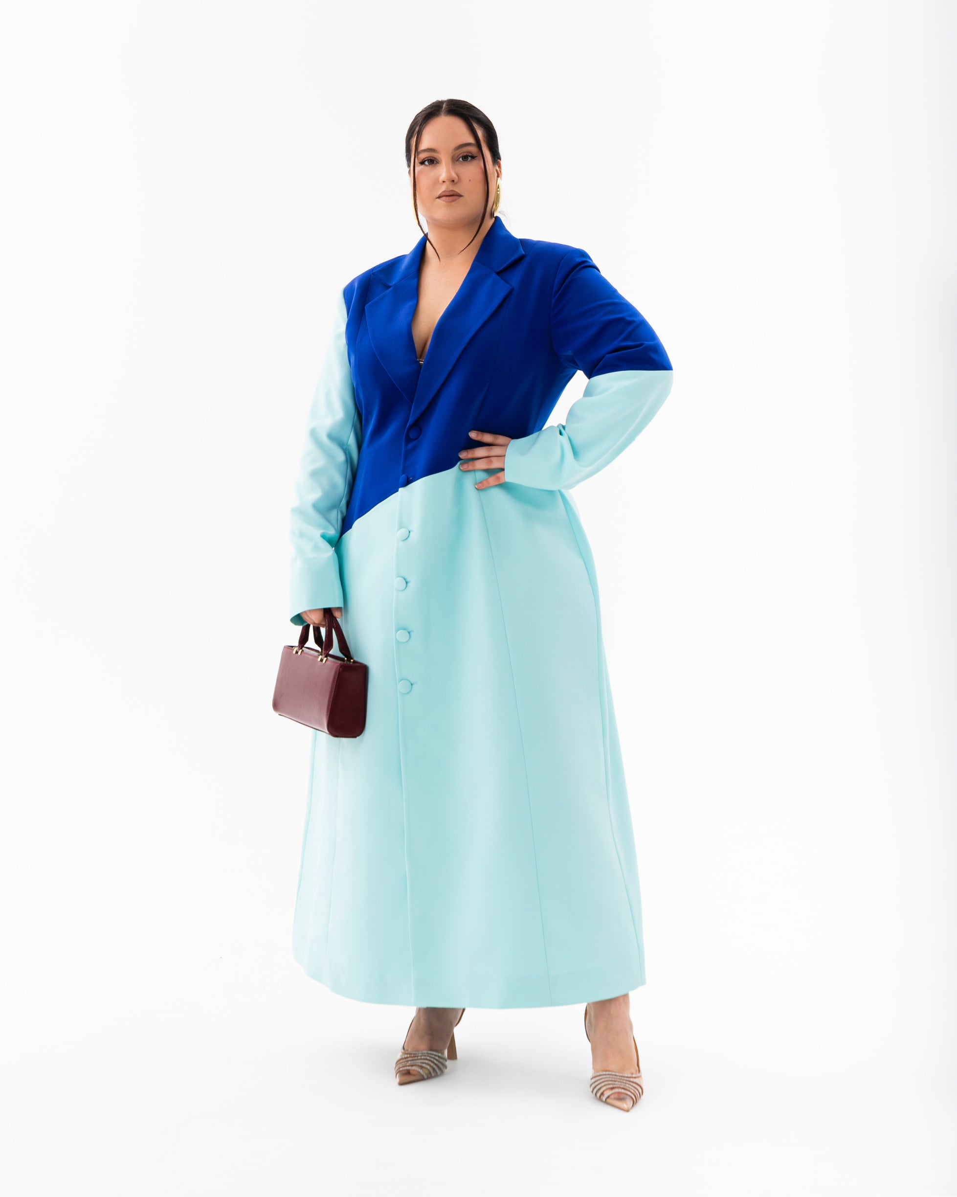 Model wearing Olarsgrace Fawn Moscato blazer dress in cobalt and pastel blue with a structured colour block design.