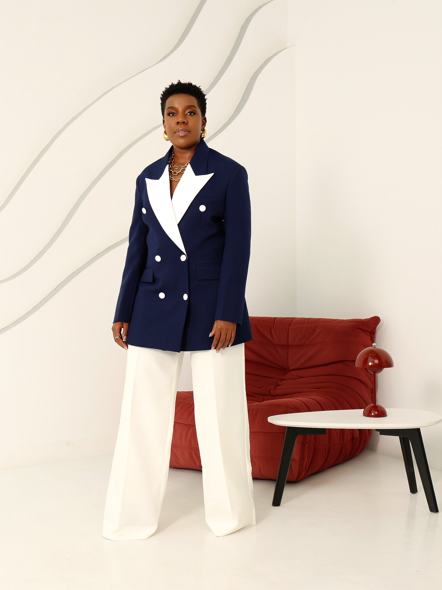 Model wearing the Olarsgrace Beloved navy and white double-breasted structured blazer paired with a high-waist straight lily pants to match elegantly.