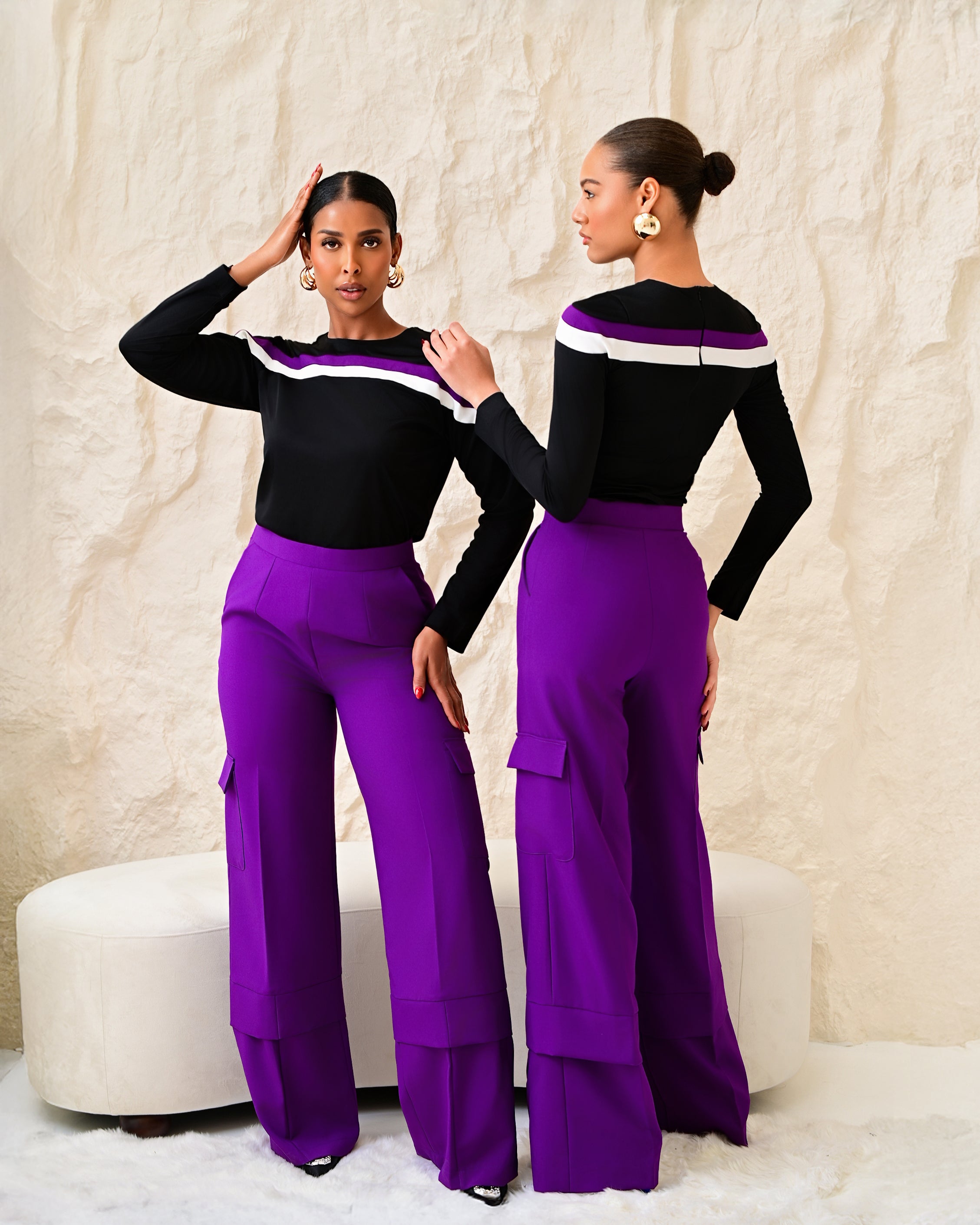 Purple straight-leg cargo trousers with side pockets styled with black striped long-sleeve top, front and back views.