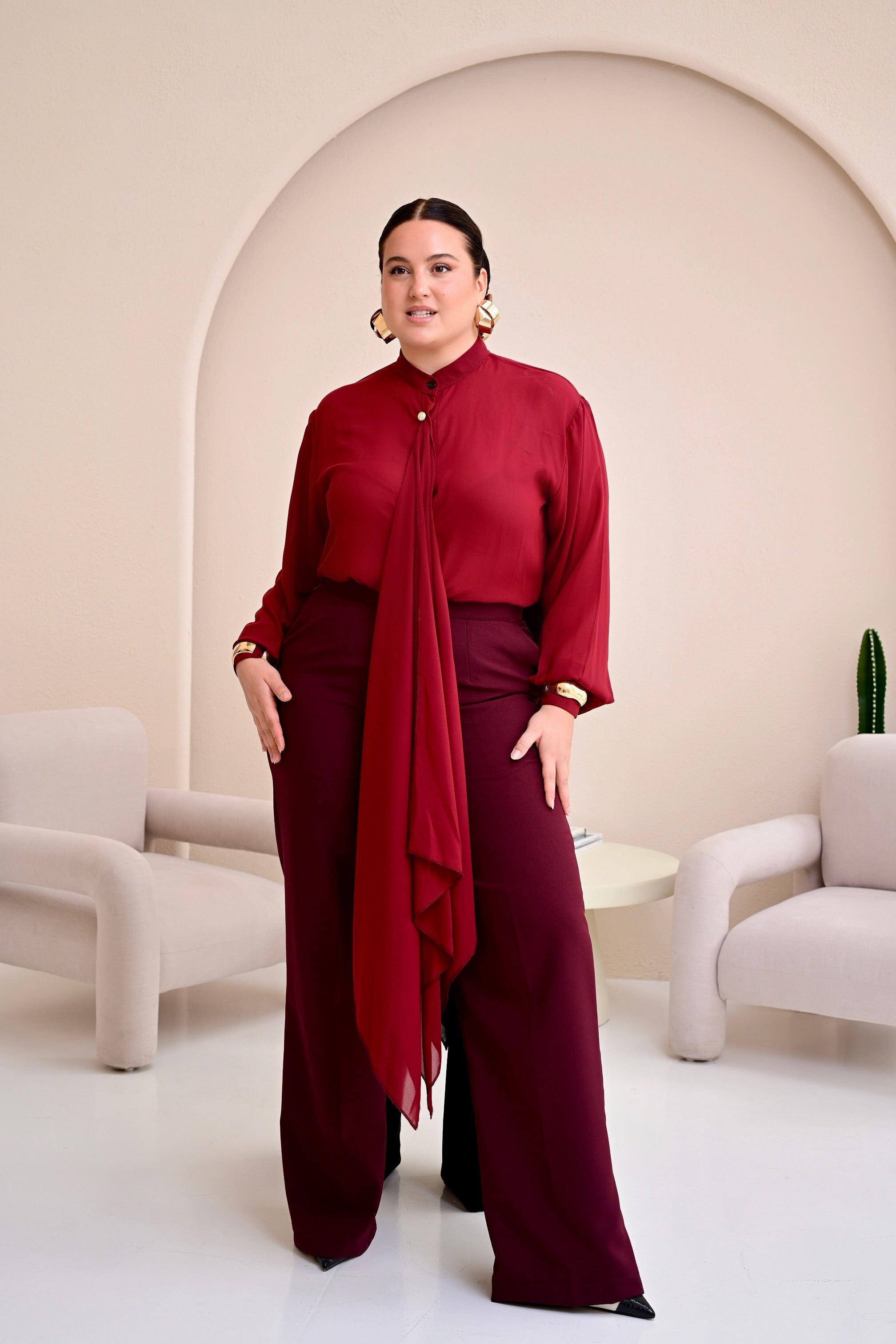 Model wearing the Wine Tabitha co-ord set with chiffon bishop-collar drape blouse and matching high-waist straight-leg pants.