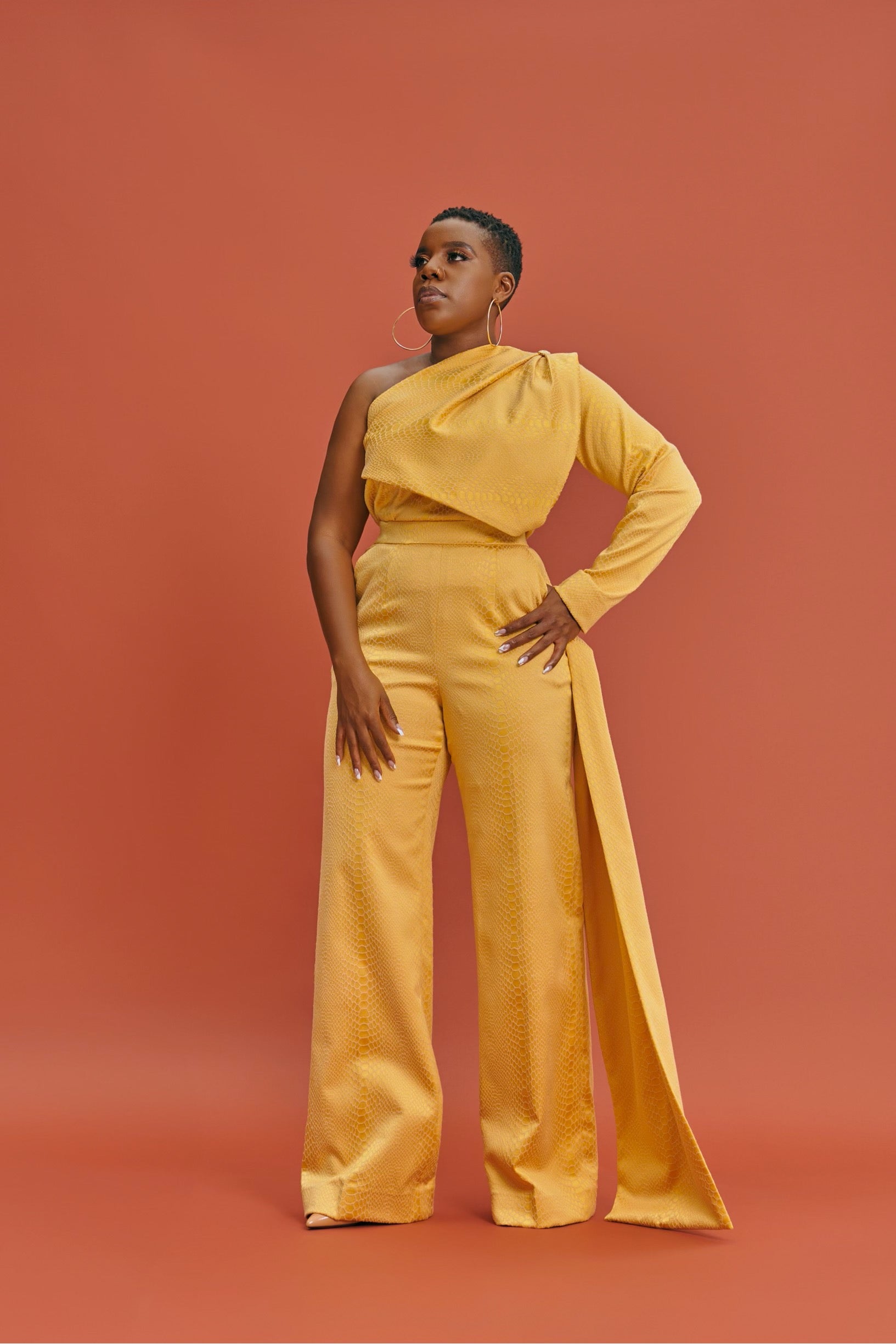 Co-ord set in goldish yellow brocade – full-length fit with statement one-shoulder top and high-waist pants.