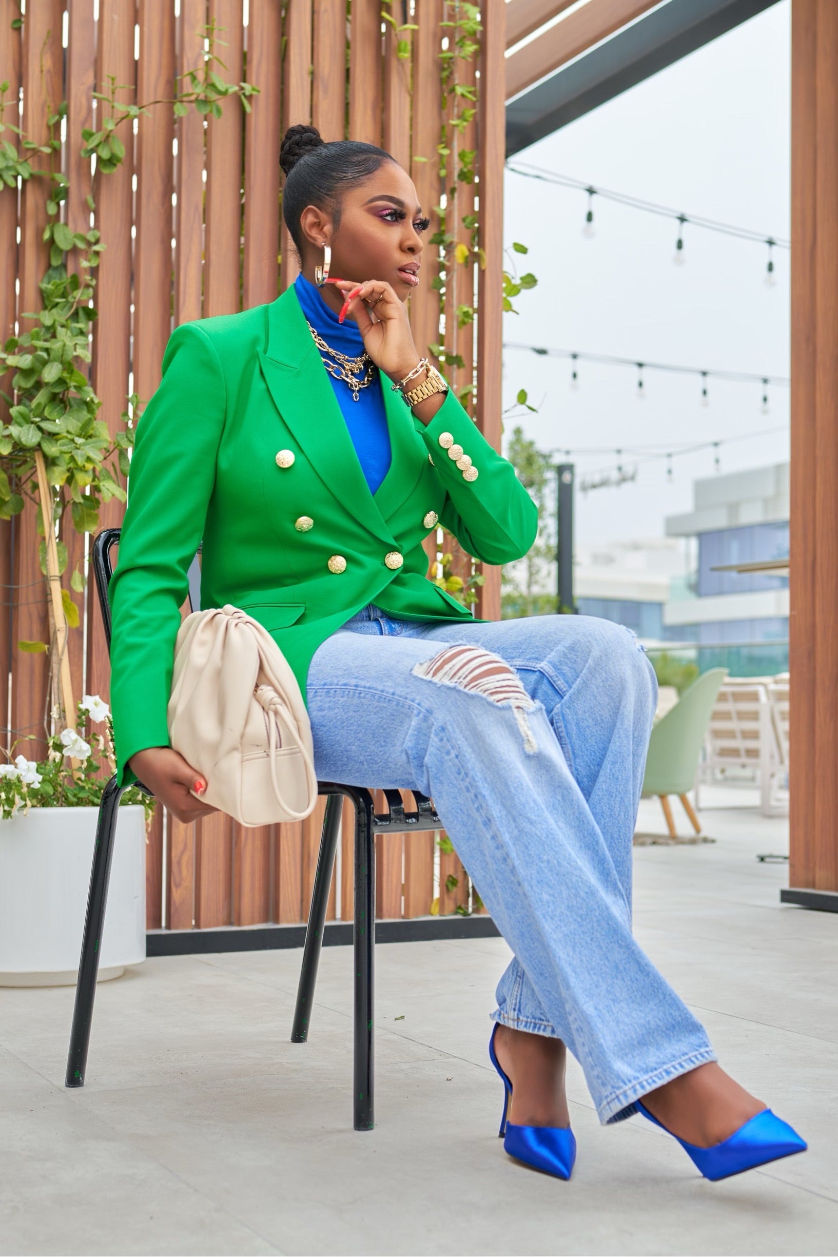 Neil Green blazer with gold buttons on sleeves and front, double-breasted tailored fit, styled with blue heels and denim.