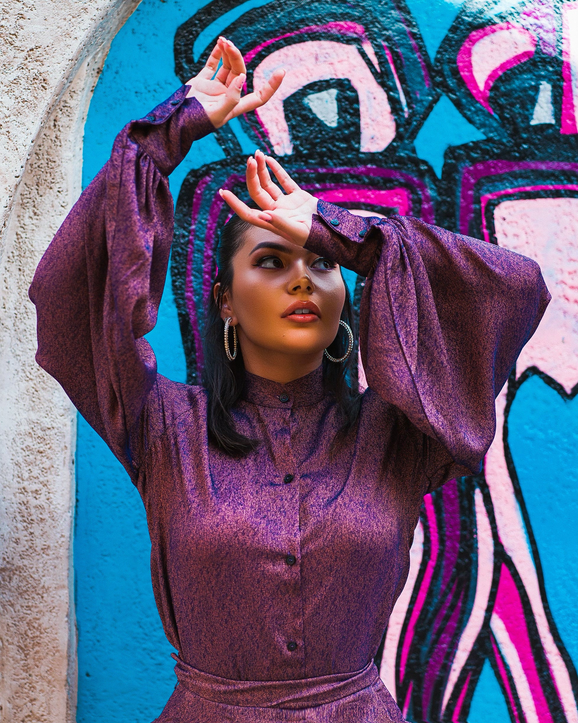 Close-up of Sabrina Set purple shimmer bishop collar blouse with balloon sleeves and button cuff.