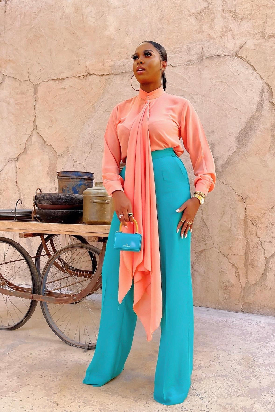 Tabitha peach and teal co-ord set with bishop collar blouse, hidden buttons and extra-long neck drape paired with high-waist straight-leg pants.